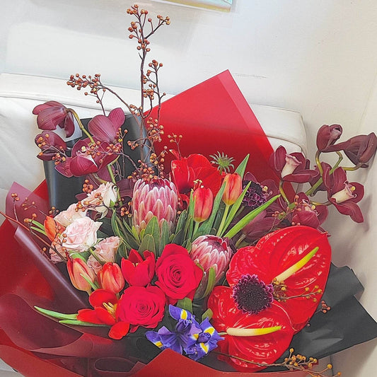 Deep red cymbidium red tulip anthurium Alice small rose amaryllis red rose protea mountain return bouquet -- – F-539 - party X party